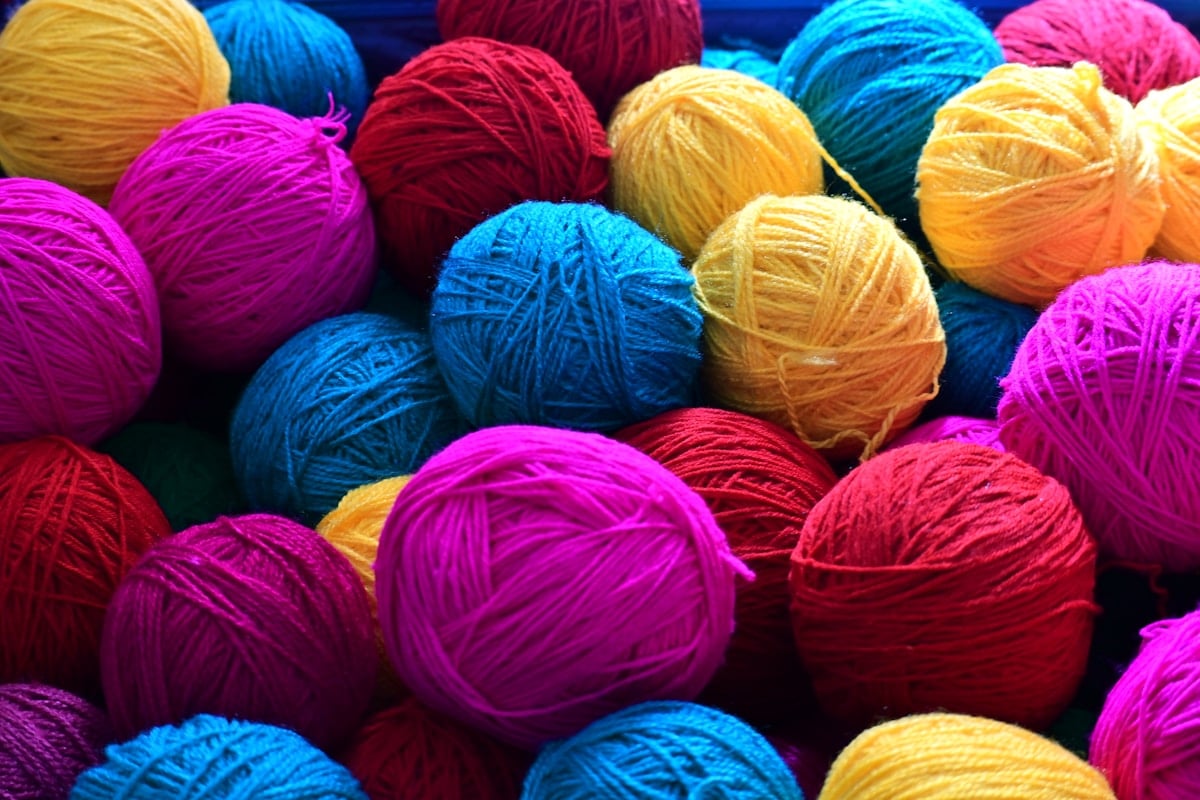 A pile of colorful yarn balls